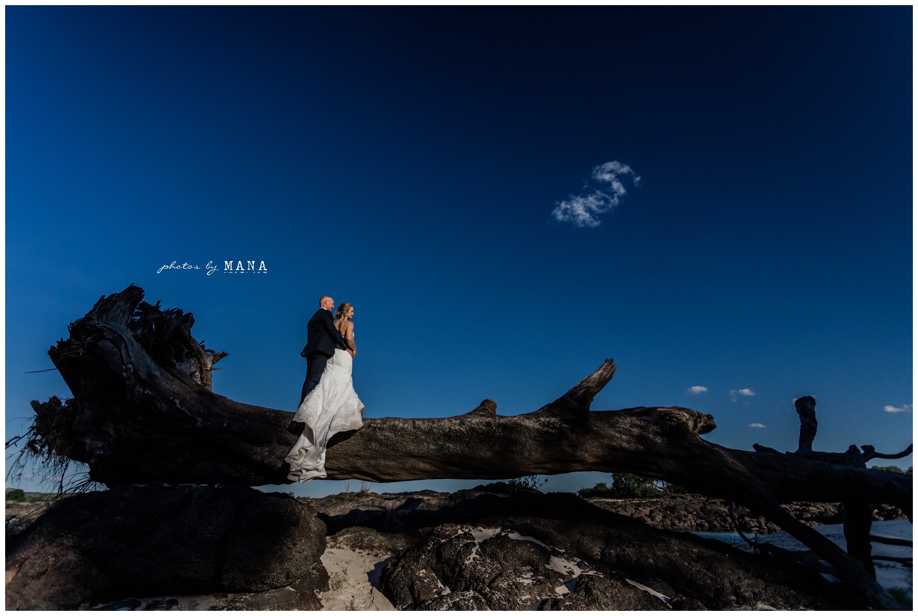 African safari wedding on the banks of the Zambezi River in Victoria Falls, Zimbabwe. Photography by Photos by Mana.