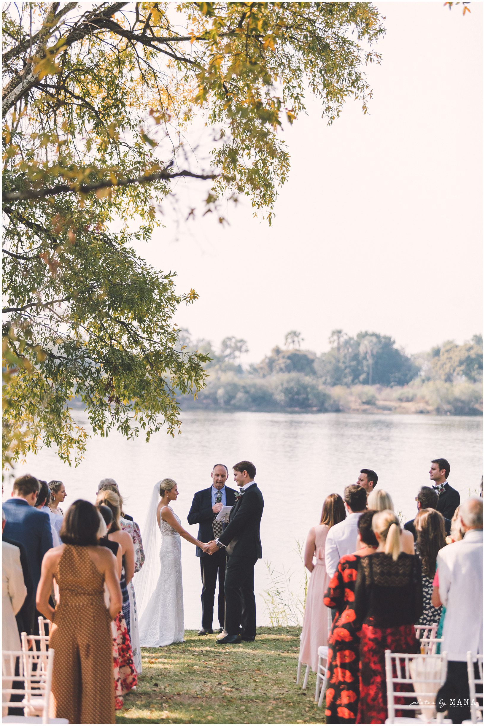 African safari wedding on the banks of the Zambezi River in Victoria Falls, Zimbabwe. Photography by Photos by Mana.