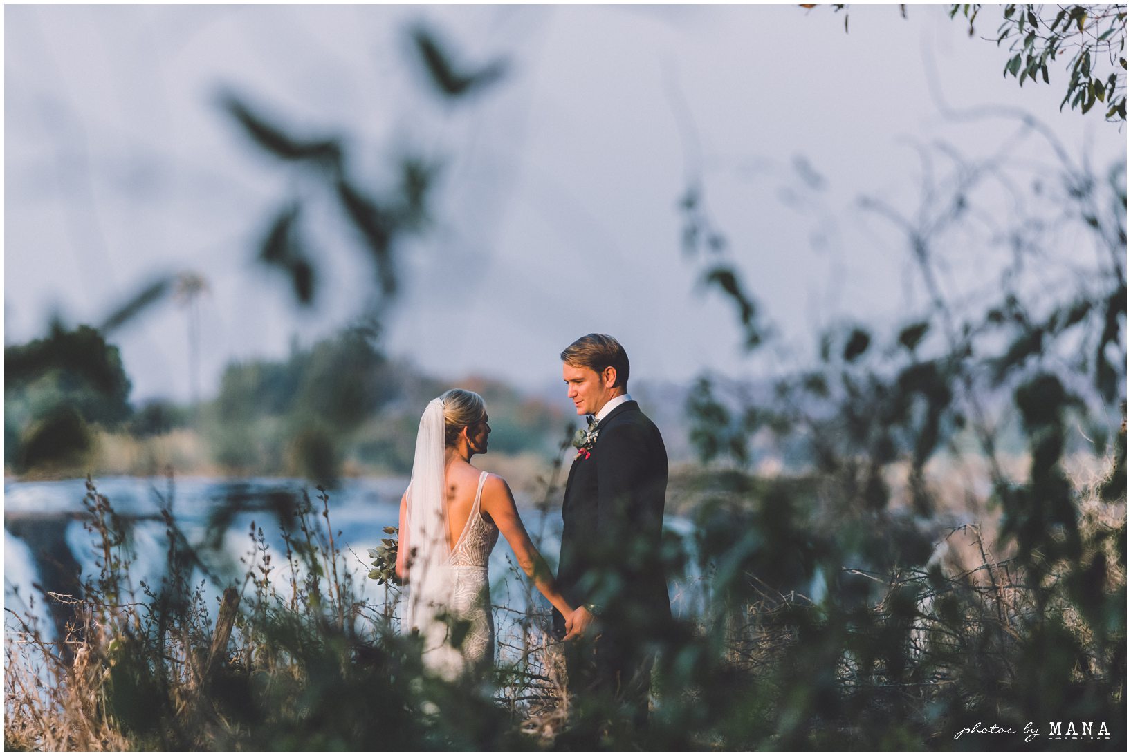 African safari wedding on the banks of the Zambezi River in Victoria Falls, Zimbabwe. Photography by Photos by Mana.