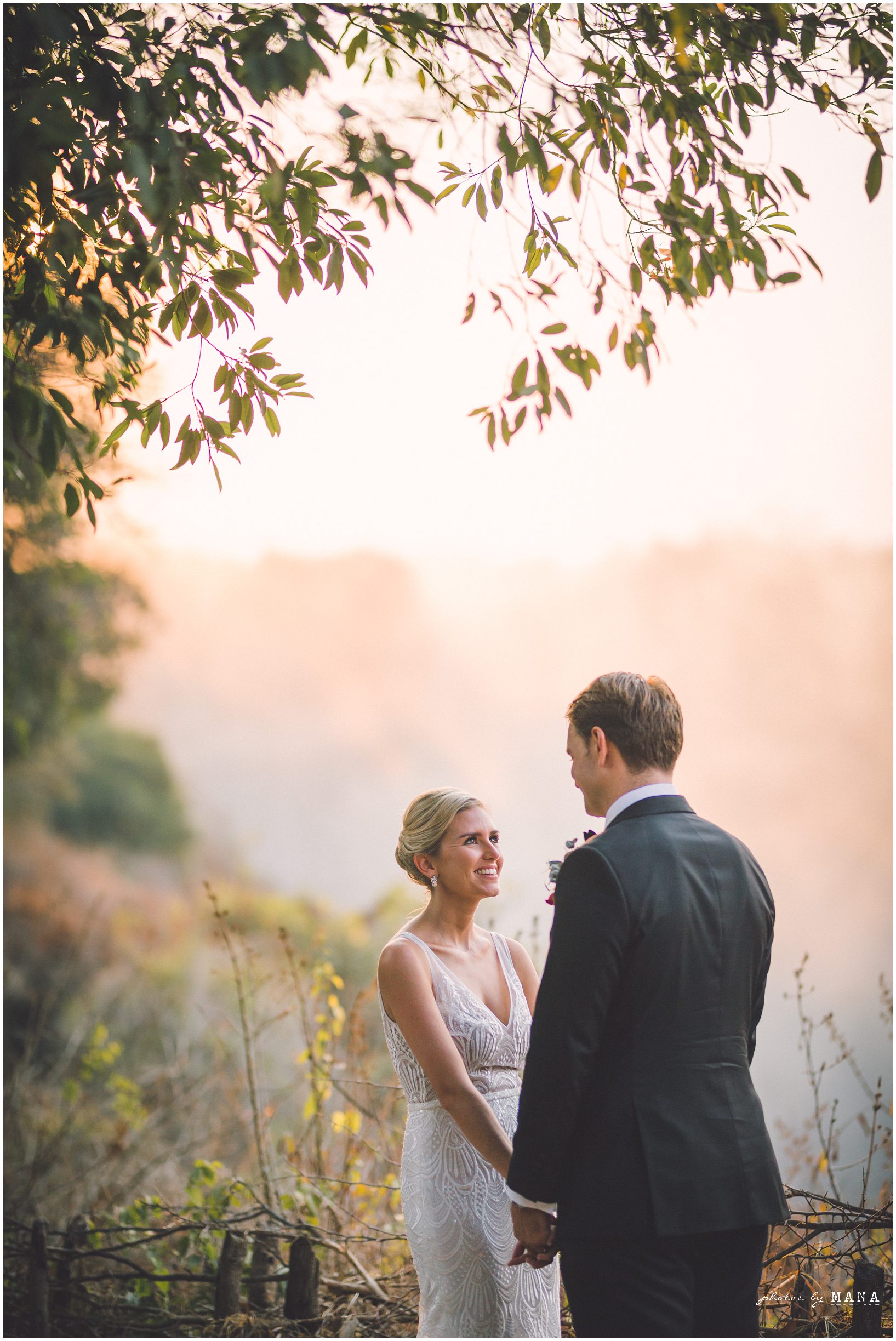 African safari wedding on the banks of the Zambezi River in Victoria Falls, Zimbabwe. Photography by Photos by Mana.