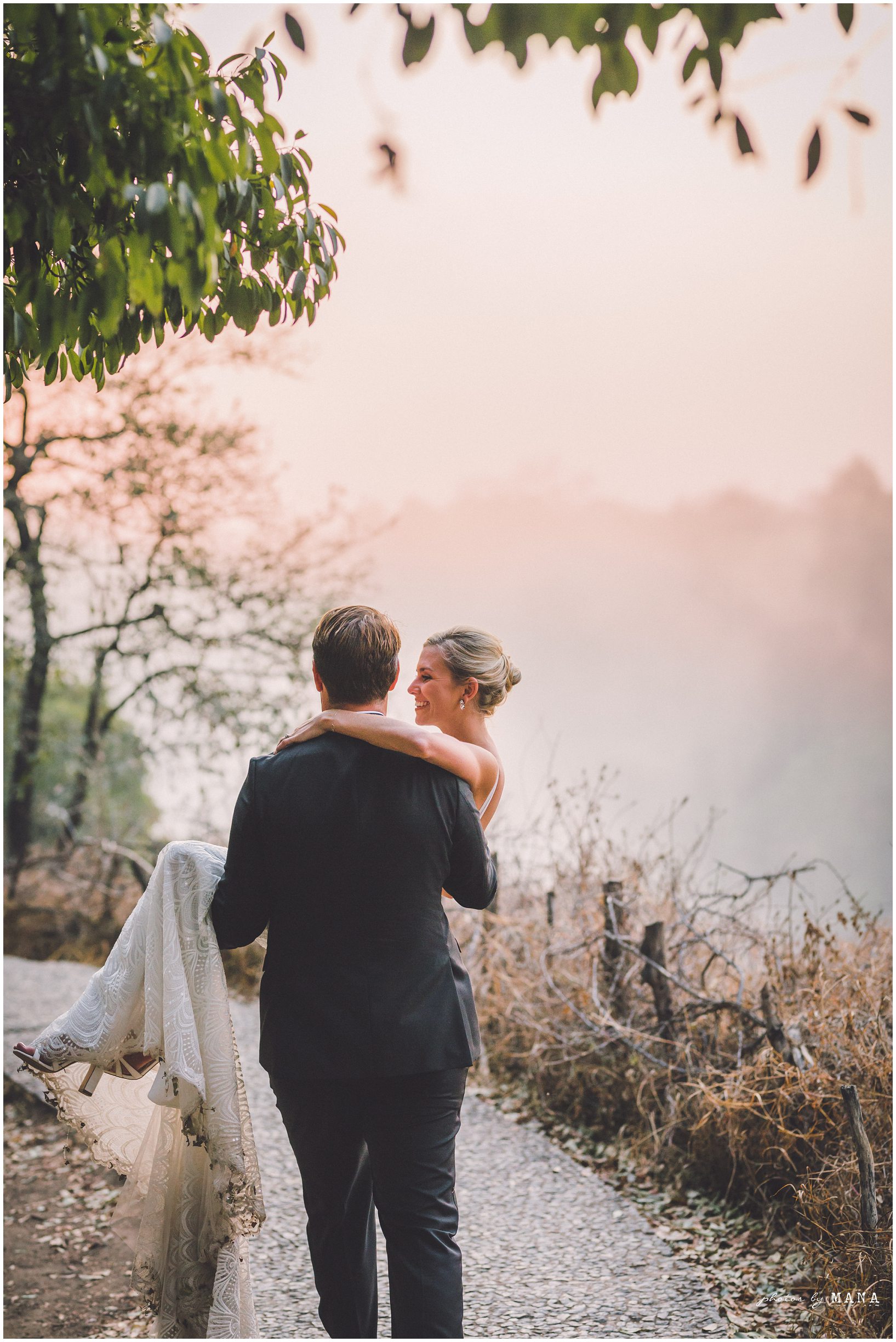 African safari wedding on the banks of the Zambezi River in Victoria Falls, Zimbabwe. Photography by Photos by Mana.